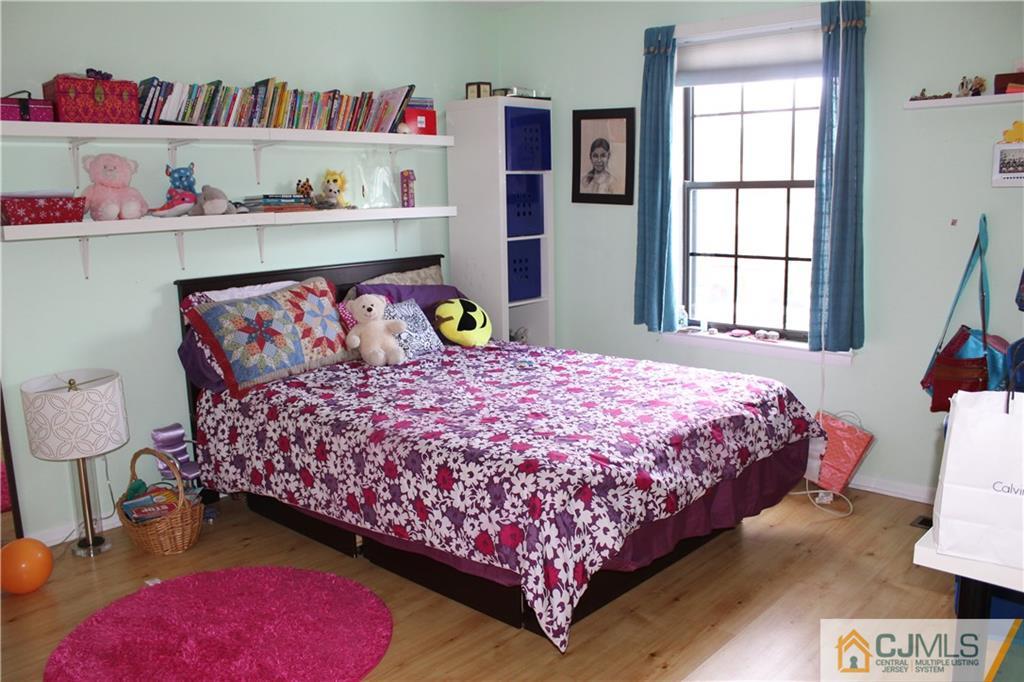 4901 Stonehedge Road, Unit 4901 Edison, NJ 08820 - Photo 18 of 22 a bedroom with a bed and a window