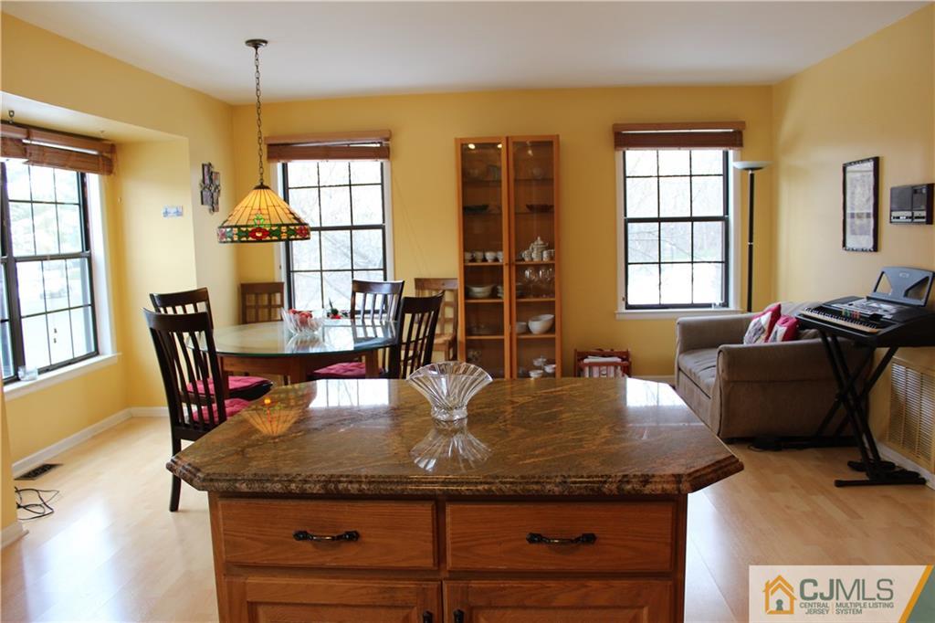 4901 Stonehedge Road, Unit 4901 Edison, NJ 08820 - Photo 9 of 22 a view of a dining room with furniture