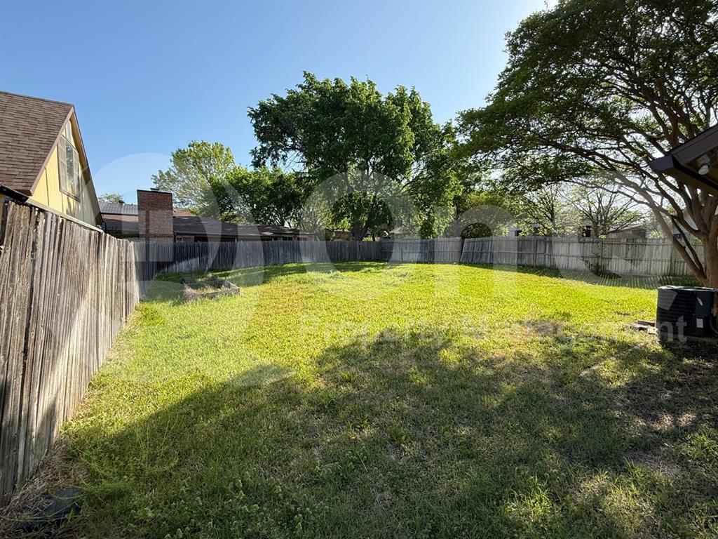 3005 Meandering Way Bedford, TX 76021 - Photo 20 of 24 Expansive grassy yard area with perimeter fencing