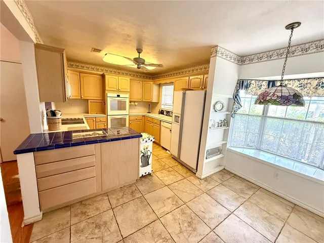 a bathroom with a sink a mirror and a shower