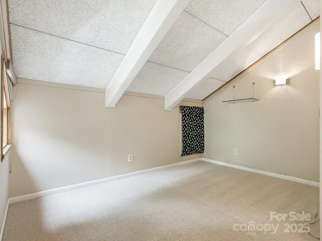 a view of an empty room with stairs