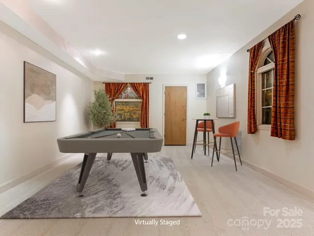 a view of a livingroom with furniture and a table