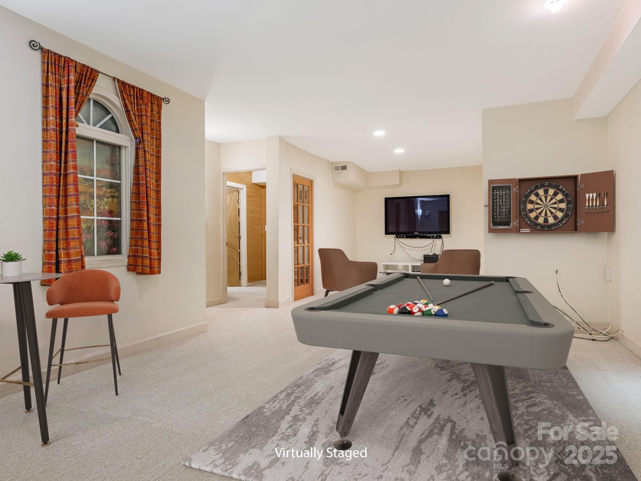 3310 Windbluff Drive Charlotte, NC 28277 - Photo 28 of 45 a living room with furniture and a flat screen tv