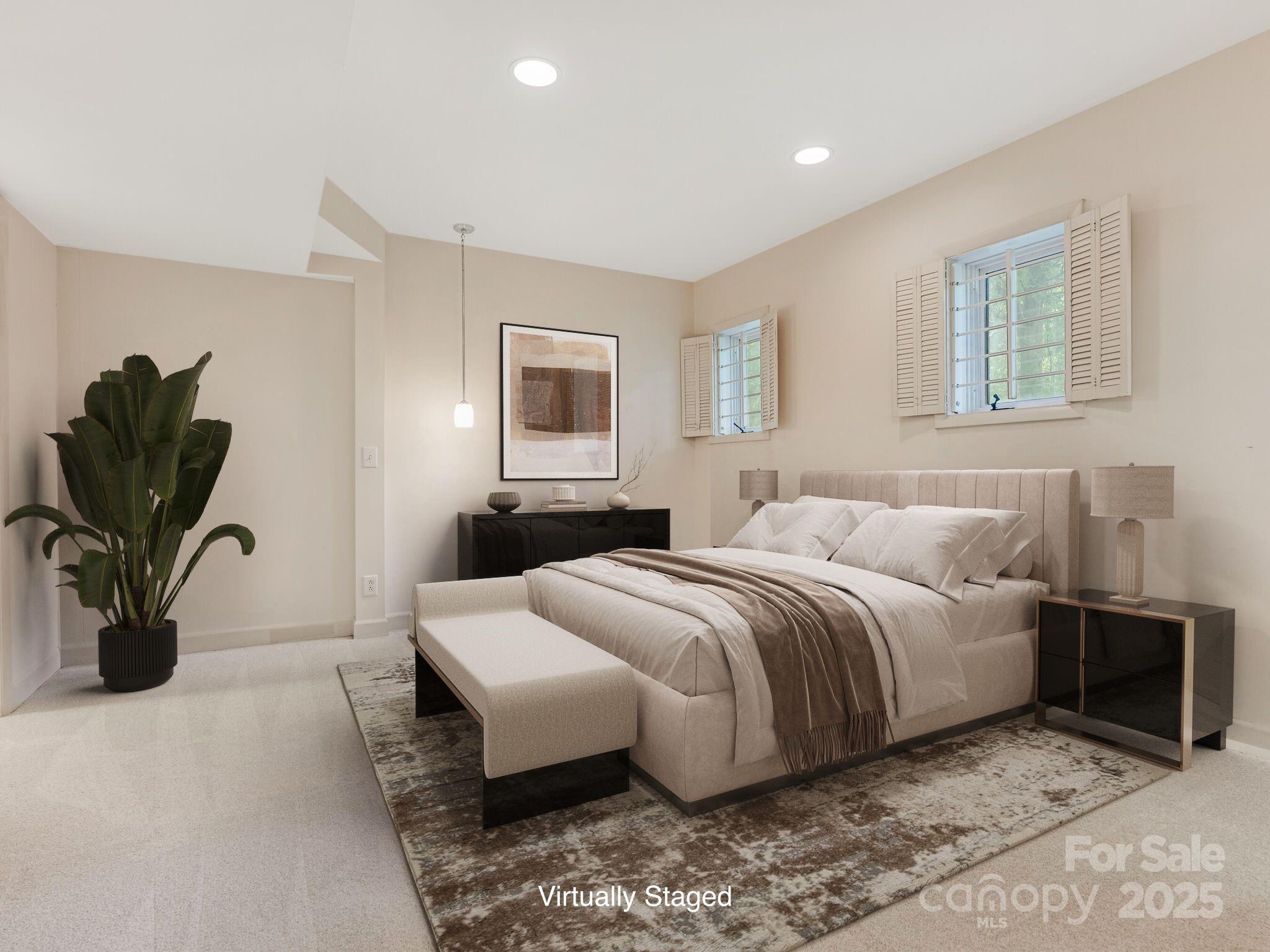 3310 Windbluff Drive Charlotte, NC 28277 - Photo 30 of 45 a bedroom with a bed and wooden floor