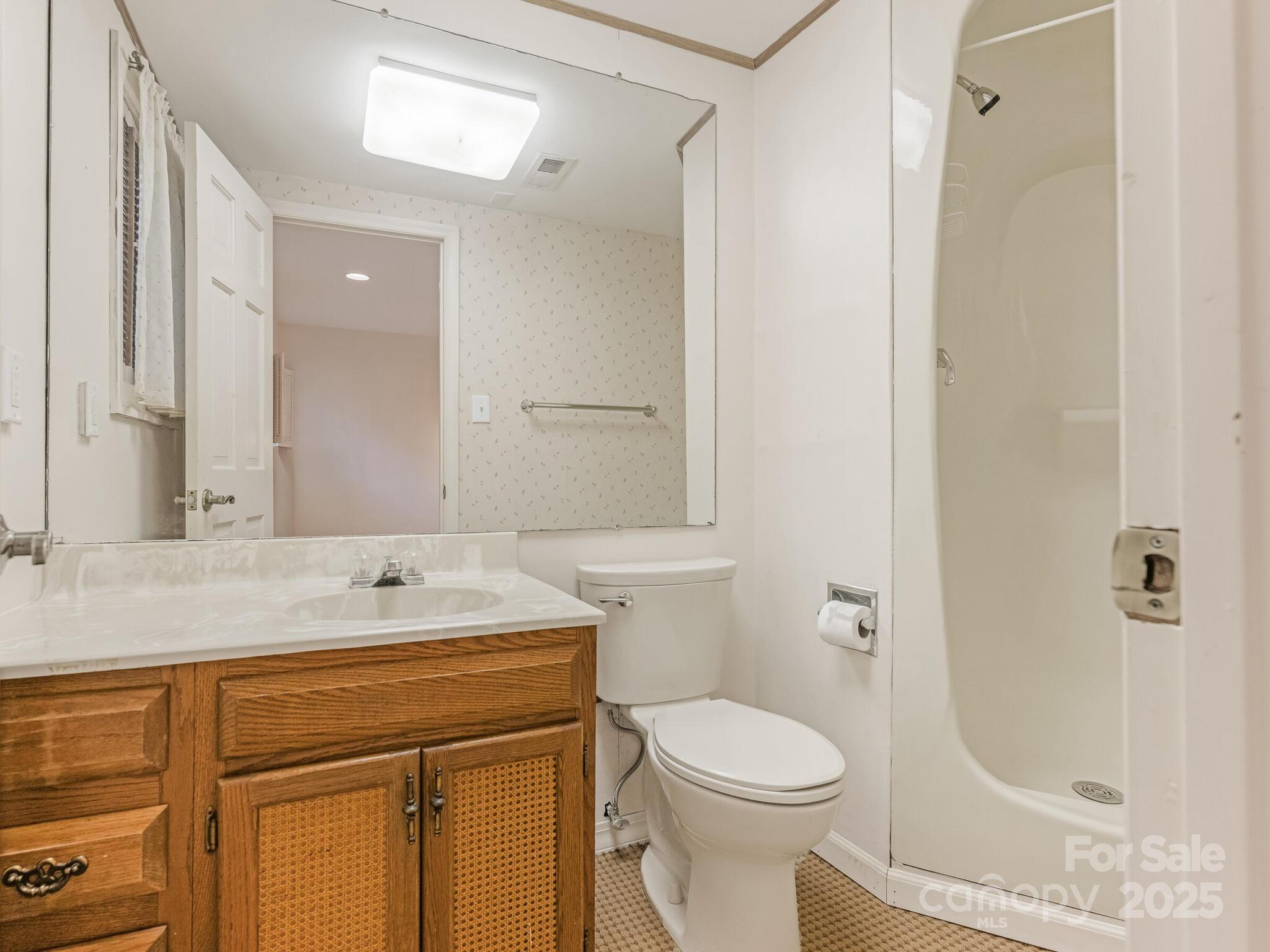 3310 Windbluff Drive Charlotte, NC 28277 - Photo 33 of 45 a bathroom with a sink toilet and shower