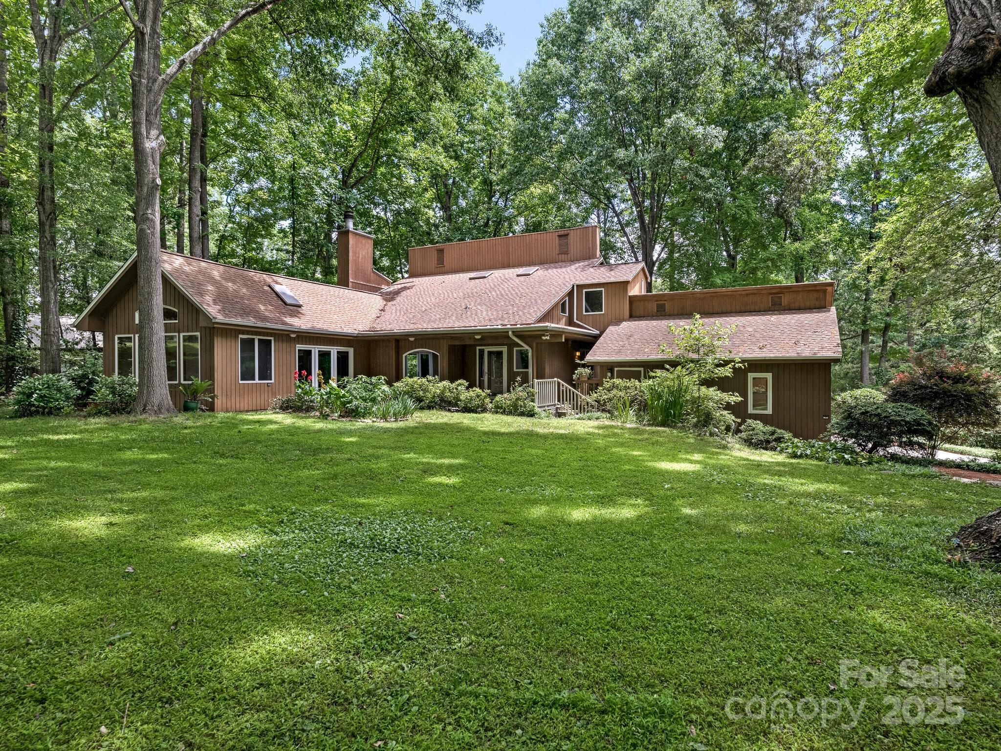 3310 Windbluff Drive Charlotte, NC 28277 - Photo 37 of 45 a front view of a house with a garden