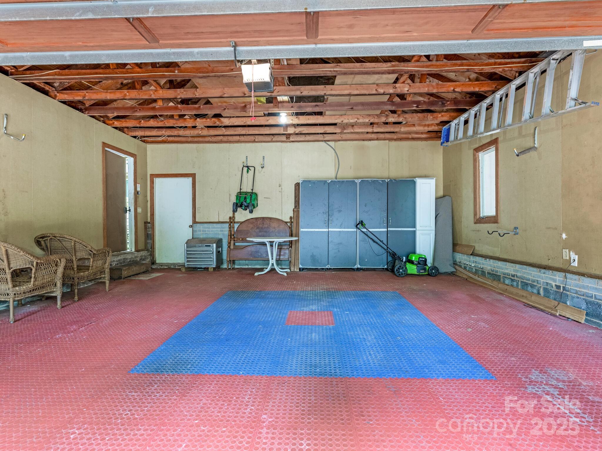 3310 Windbluff Drive Charlotte, NC 28277 - Photo 40 of 45 a view of a room with wooden floor and furniture