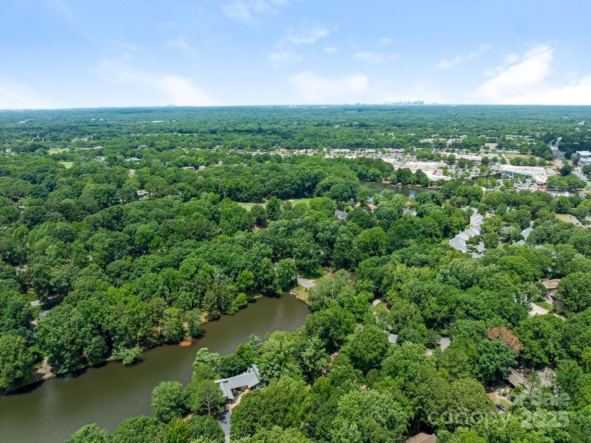 3310 Windbluff Drive Charlotte, NC 28277 - Photo 42 of 45 an aerial view of residential houses with outdoor space and trees