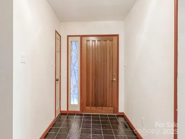 a view of a room with wooden door