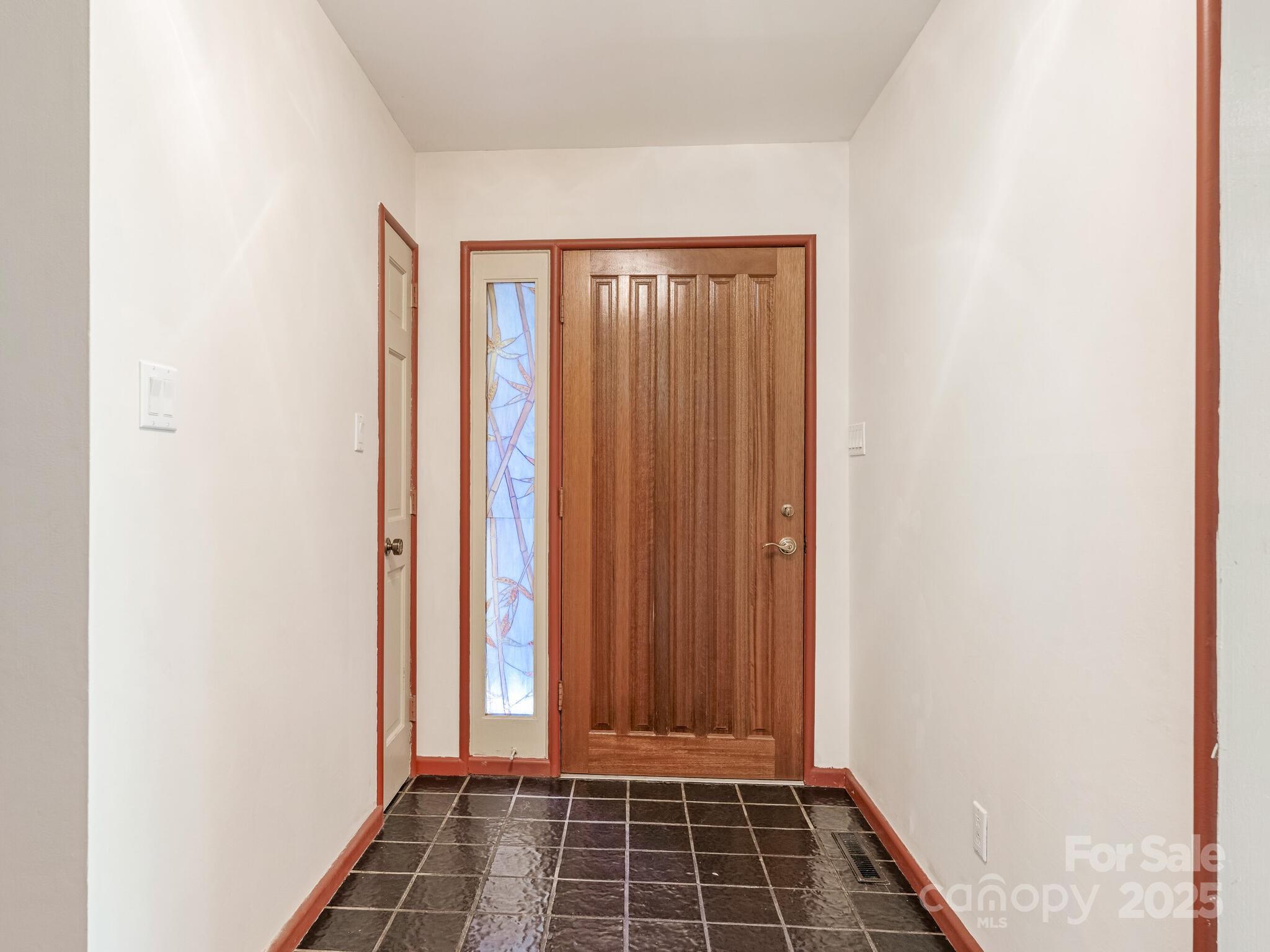 3310 Windbluff Drive Charlotte, NC 28277 - Photo 5 of 45 a view of a room with wooden door