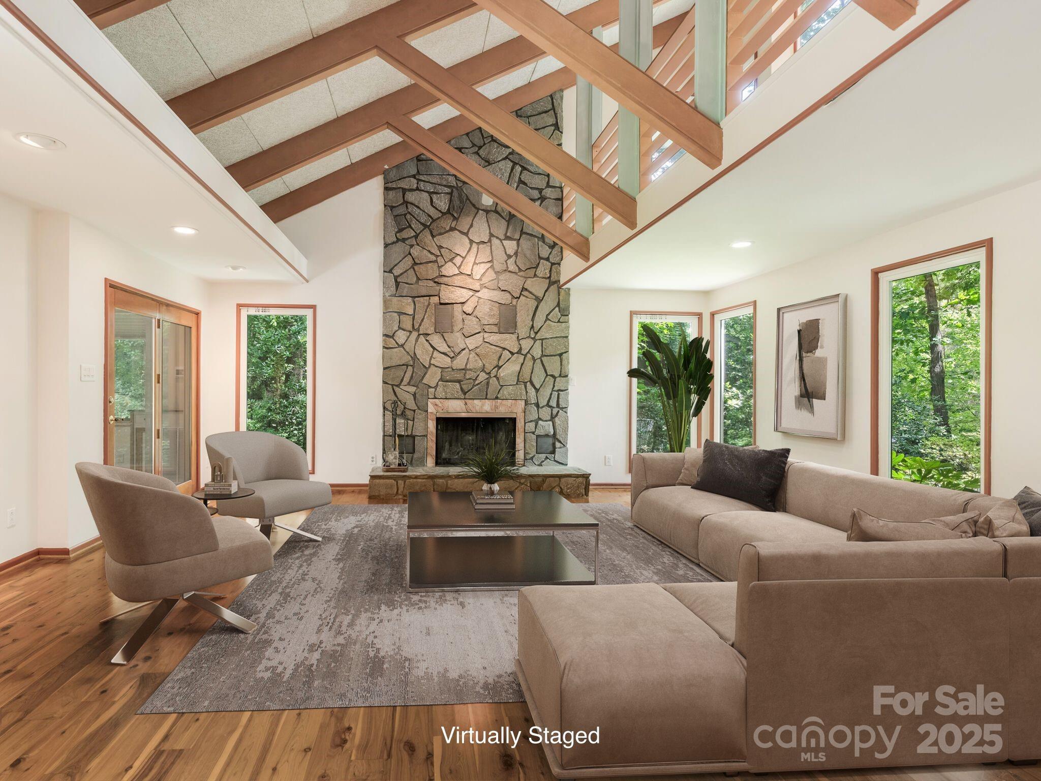 3310 Windbluff Drive Charlotte, NC 28277 - Photo 7 of 45 a living room with furniture and a fireplace