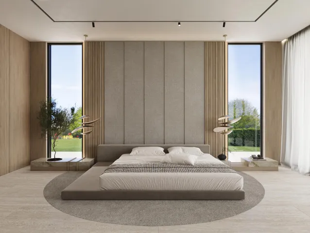 a bedroom with a bed and a potted plant