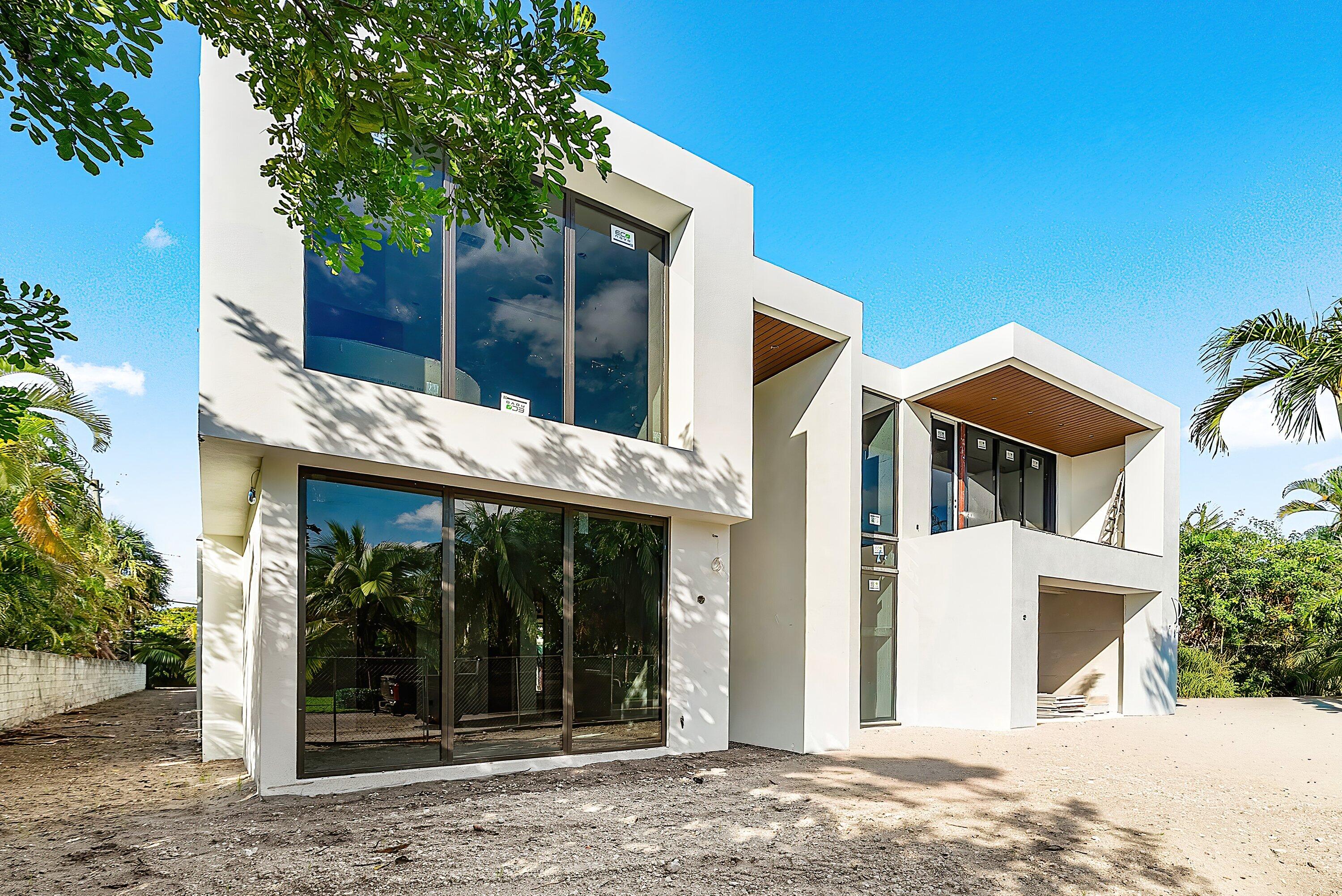 1505 Northeast 4th Avenue Boca Raton, FL 33432 - Photo 26 of 39 a view of a house with a yard and plants