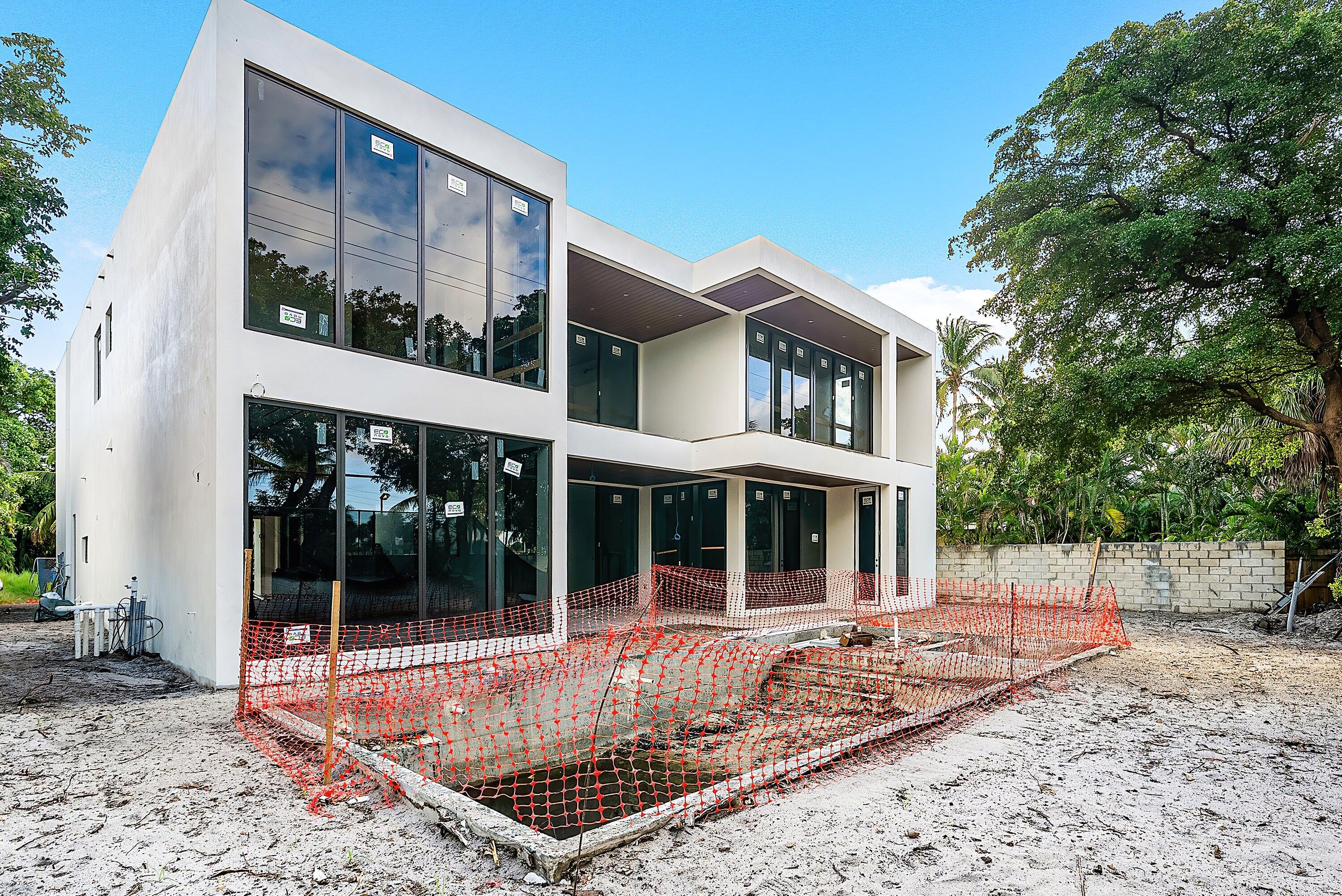 1505 Northeast 4th Avenue Boca Raton, FL 33432 - Photo 36 of 39 a view of a house with a large window and plants