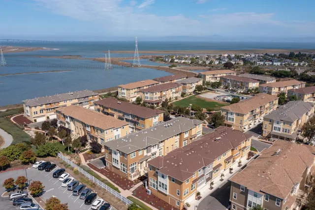 a view of a patio with a table chairs and a slide