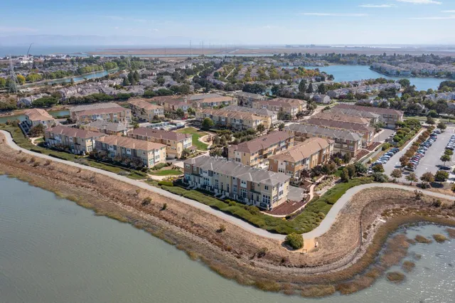 an aerial view of a house with a lake view