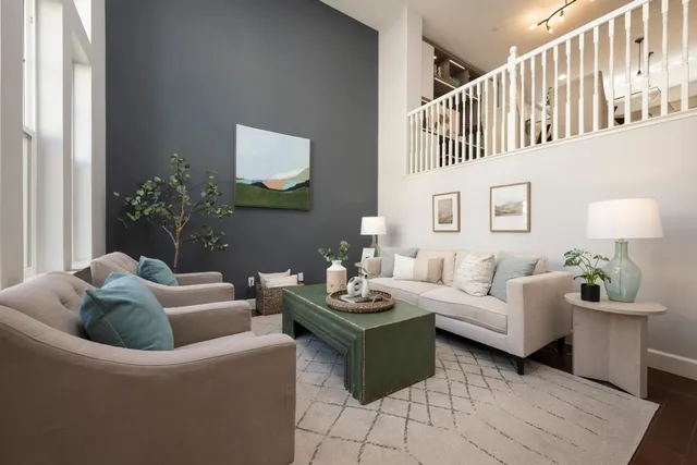 a living room with furniture and a table