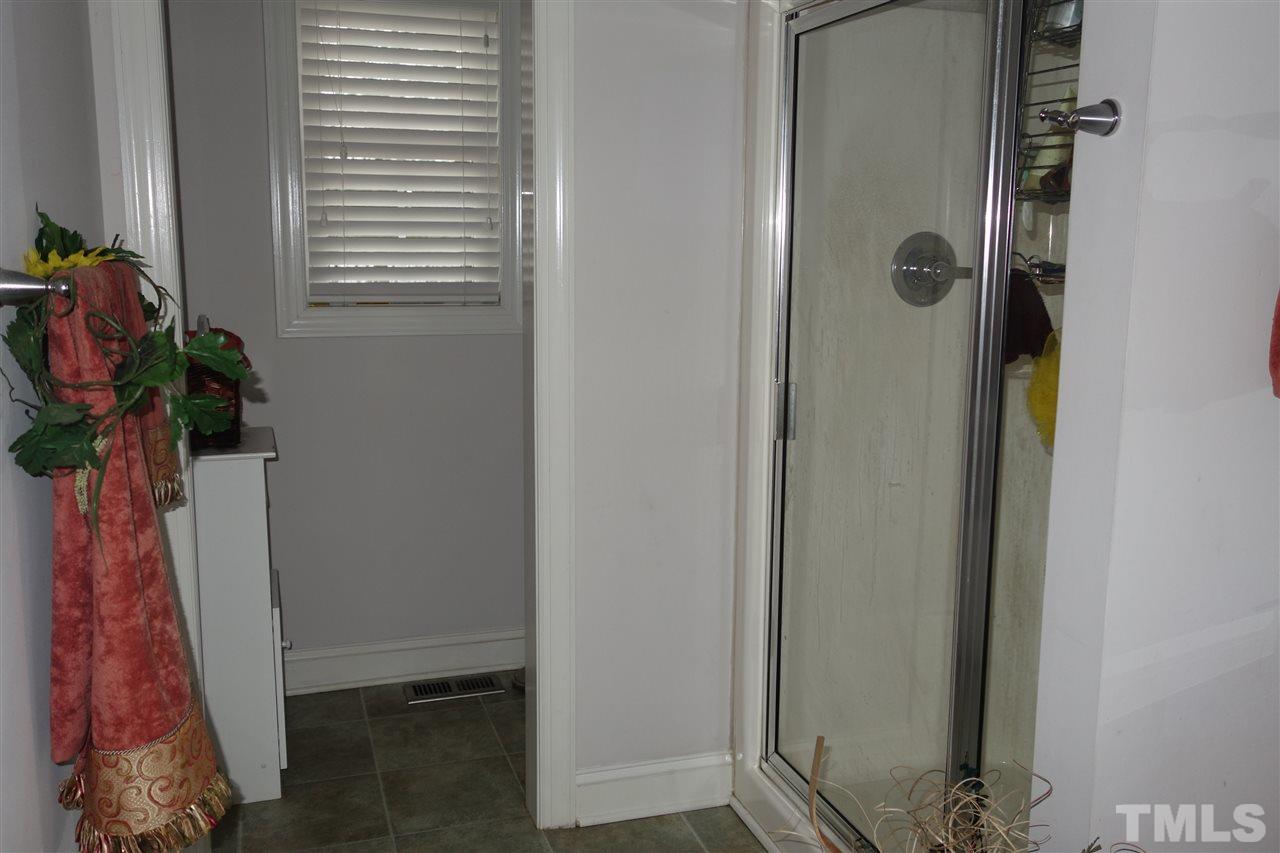 5638 Raleigh Road Kittrell, NC 27544 - Photo 14 of 25 a bathroom with a shower