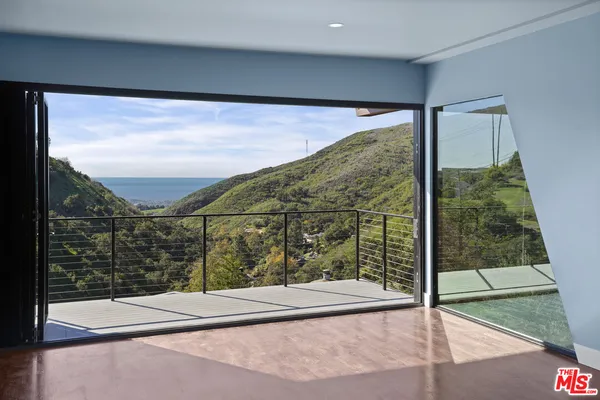 a view of a glass door and the window