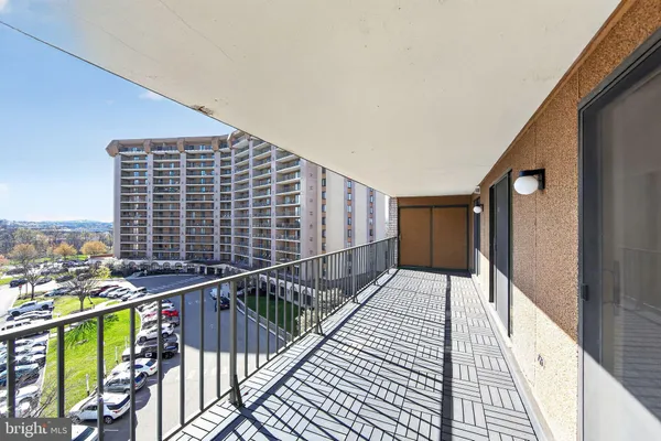 a view of balcony with wooden floor and stairs