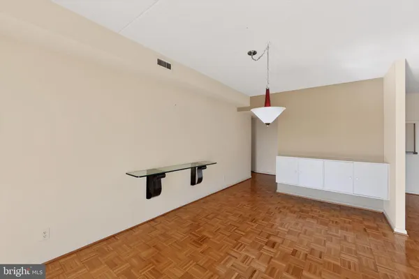 a view of a room with a ceiling fan