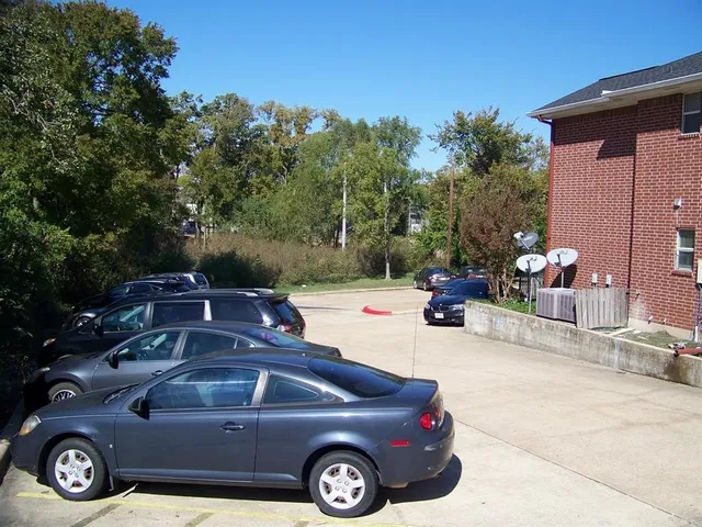 a view of a car parked in front of a house