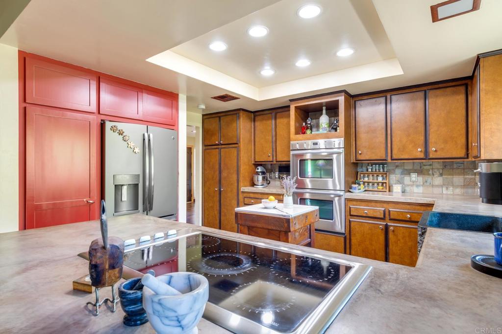1106 Big Oak Ranch Road Fallbrook, CA 92028 - Photo 18 of 53 a kitchen with a refrigerator and sink