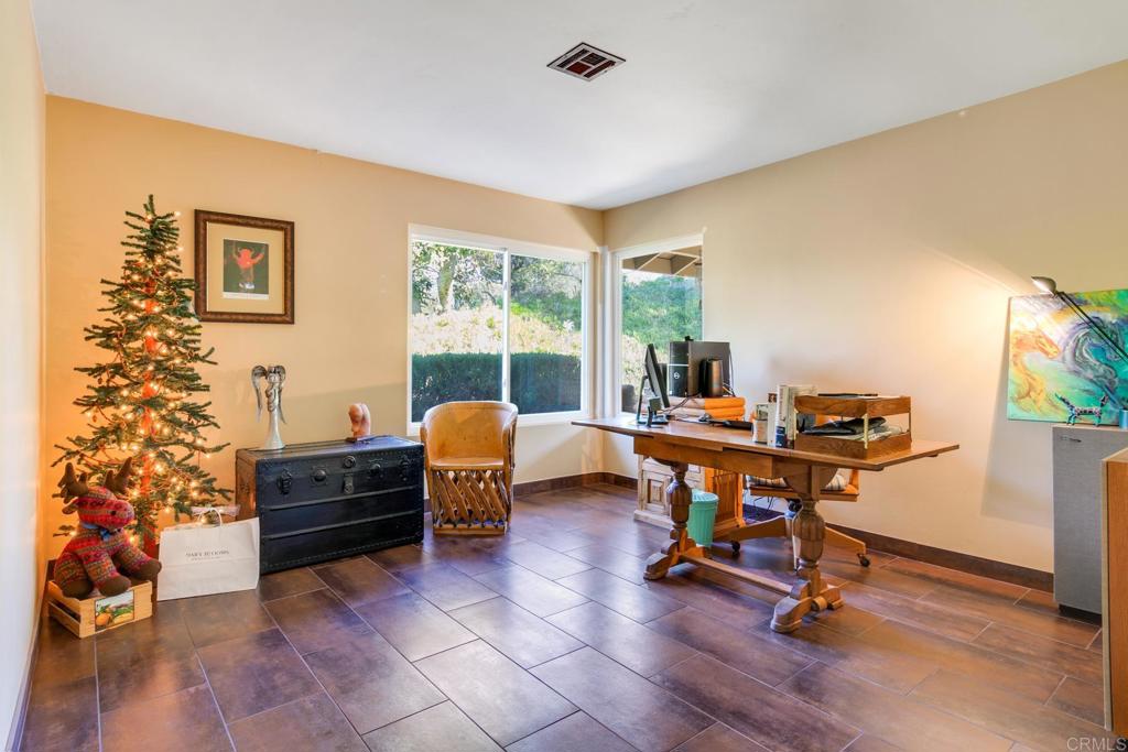 1106 Big Oak Ranch Road Fallbrook, CA 92028 - Photo 20 of 53 a view of a workspace with furniture and a window