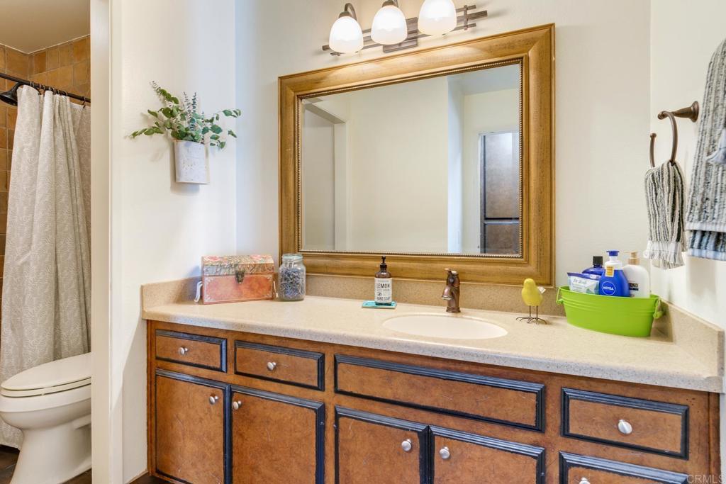 1106 Big Oak Ranch Road Fallbrook, CA 92028 - Photo 27 of 53 a bathroom with a sink vanity granite and a mirror