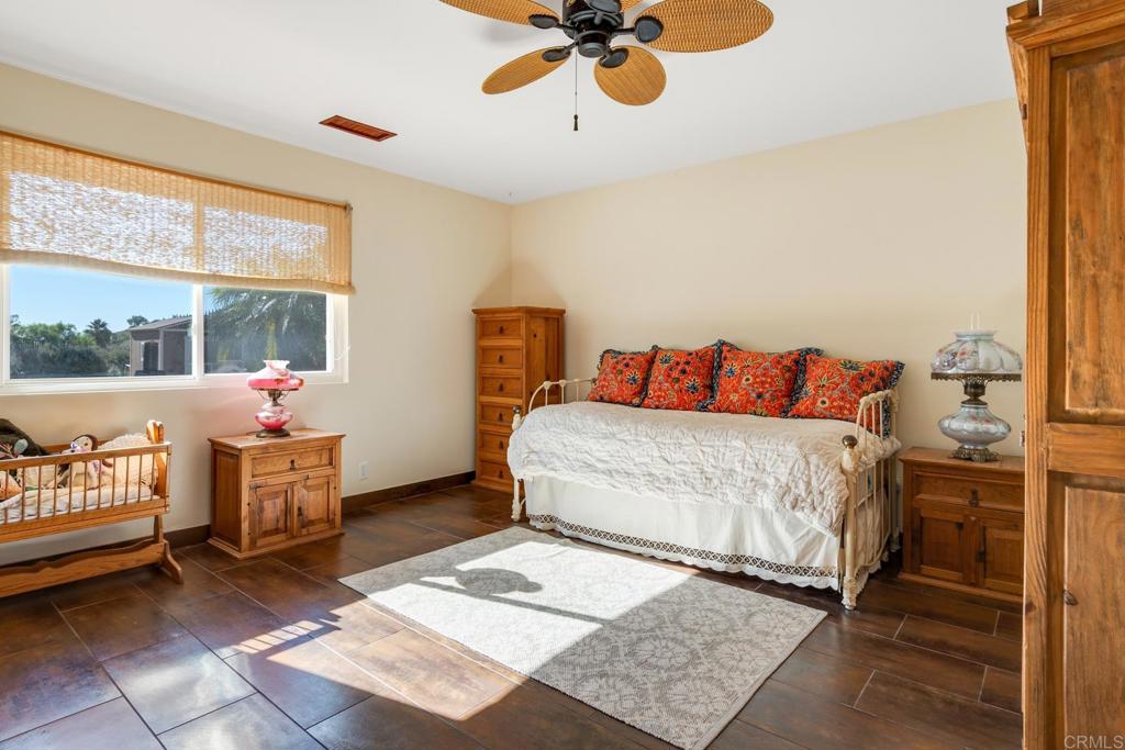 1106 Big Oak Ranch Road Fallbrook, CA 92028 - Photo 31 of 53 a bed room with a bed and a chair