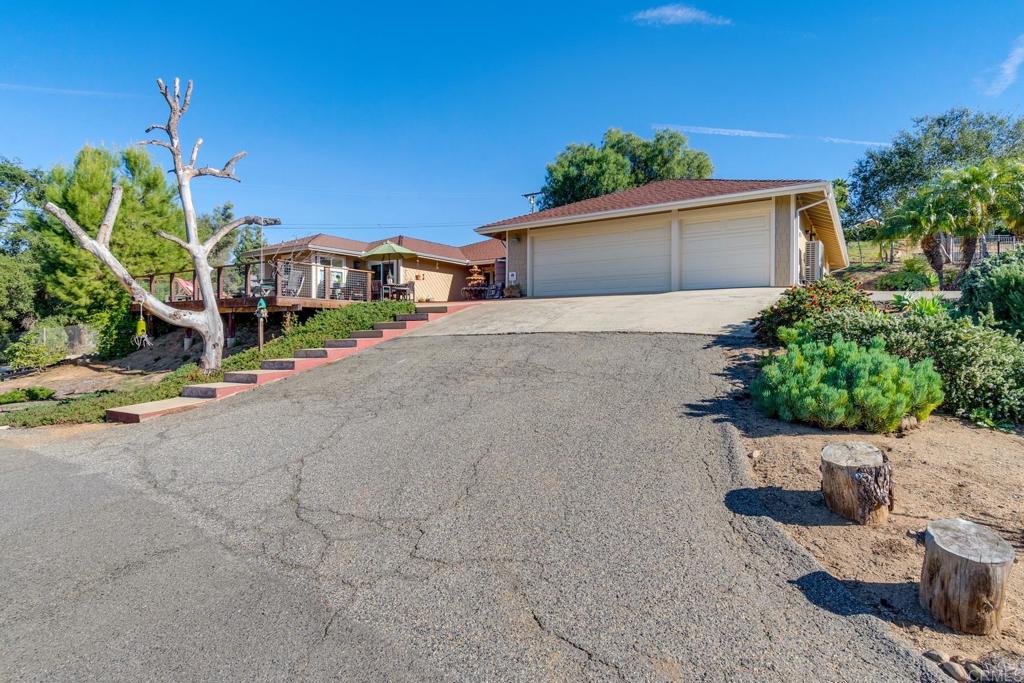 1106 Big Oak Ranch Road Fallbrook, CA 92028 - Photo 38 of 53 a front view of a house with a yard
