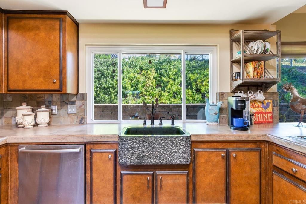 1106 Big Oak Ranch Road Fallbrook, CA 92028 - Photo 4 of 53 a kitchen with sink a window and cabinets