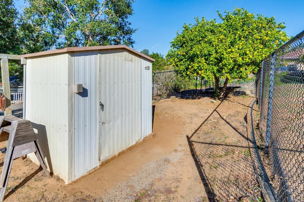1106 Big Oak Ranch Road Fallbrook, CA 92028 - Photo 45 of 53 a view of a house with backyard and a tree