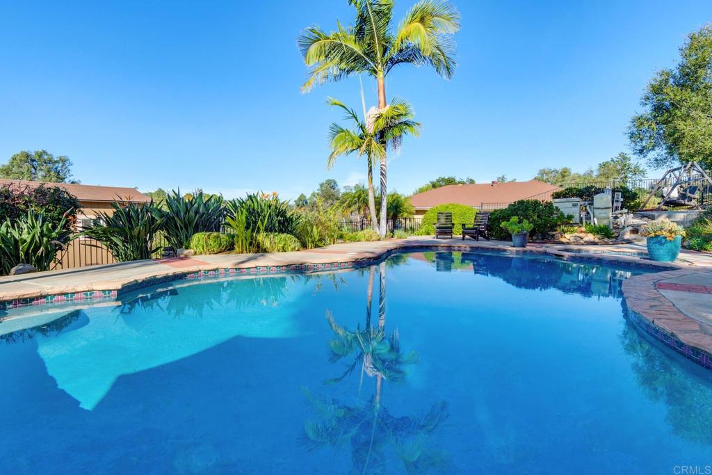 1106 Big Oak Ranch Road Fallbrook, CA 92028 - Photo 48 of 53 a view of a lake with a house in the background