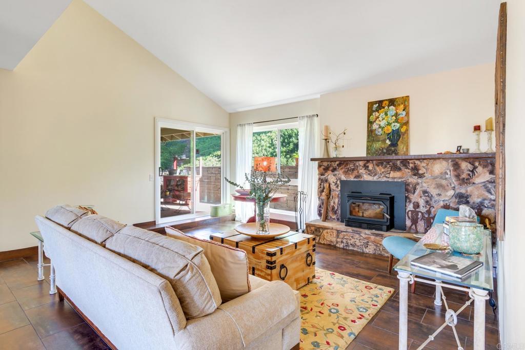 1106 Big Oak Ranch Road Fallbrook, CA 92028 - Photo 5 of 53 a living room with furniture and a fireplace