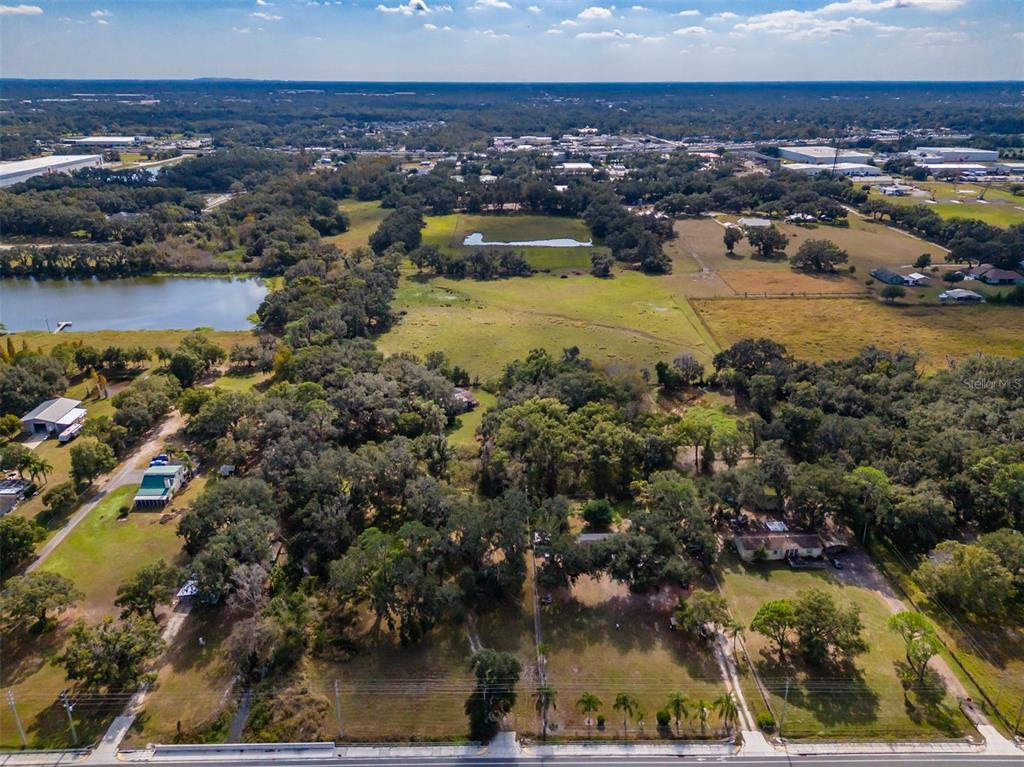 815 East Sam Allen Road Plant City, FL 33563 - Photo 15 of 27 an aerial view of residential houses with outdoor space