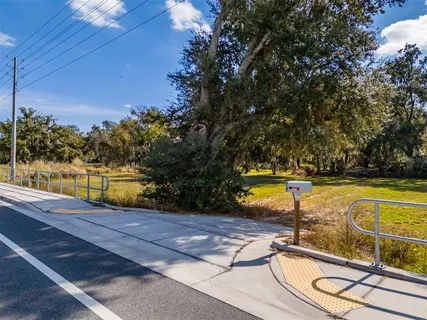 a view of a swimming pool with an outdoor space and seating area
