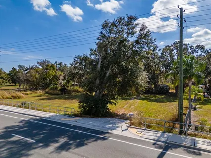 a view of a swimming pool with an outdoor space and seating area