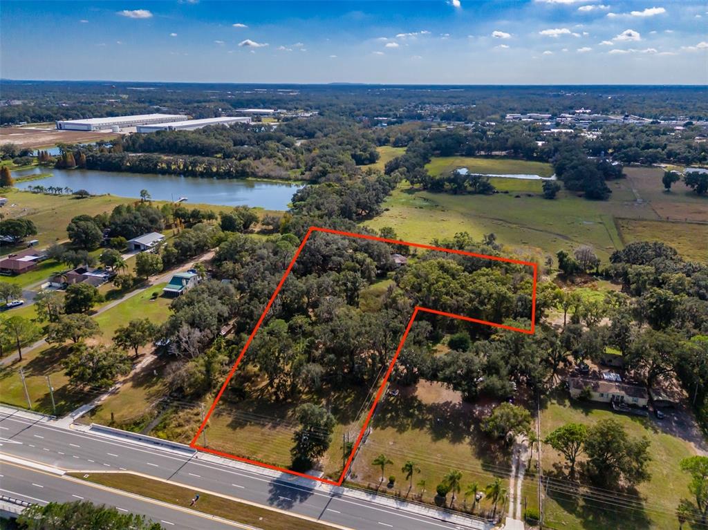 815 East Sam Allen Road Plant City, FL 33563 - Photo 6 of 27 an aerial view of residential houses with outdoor space