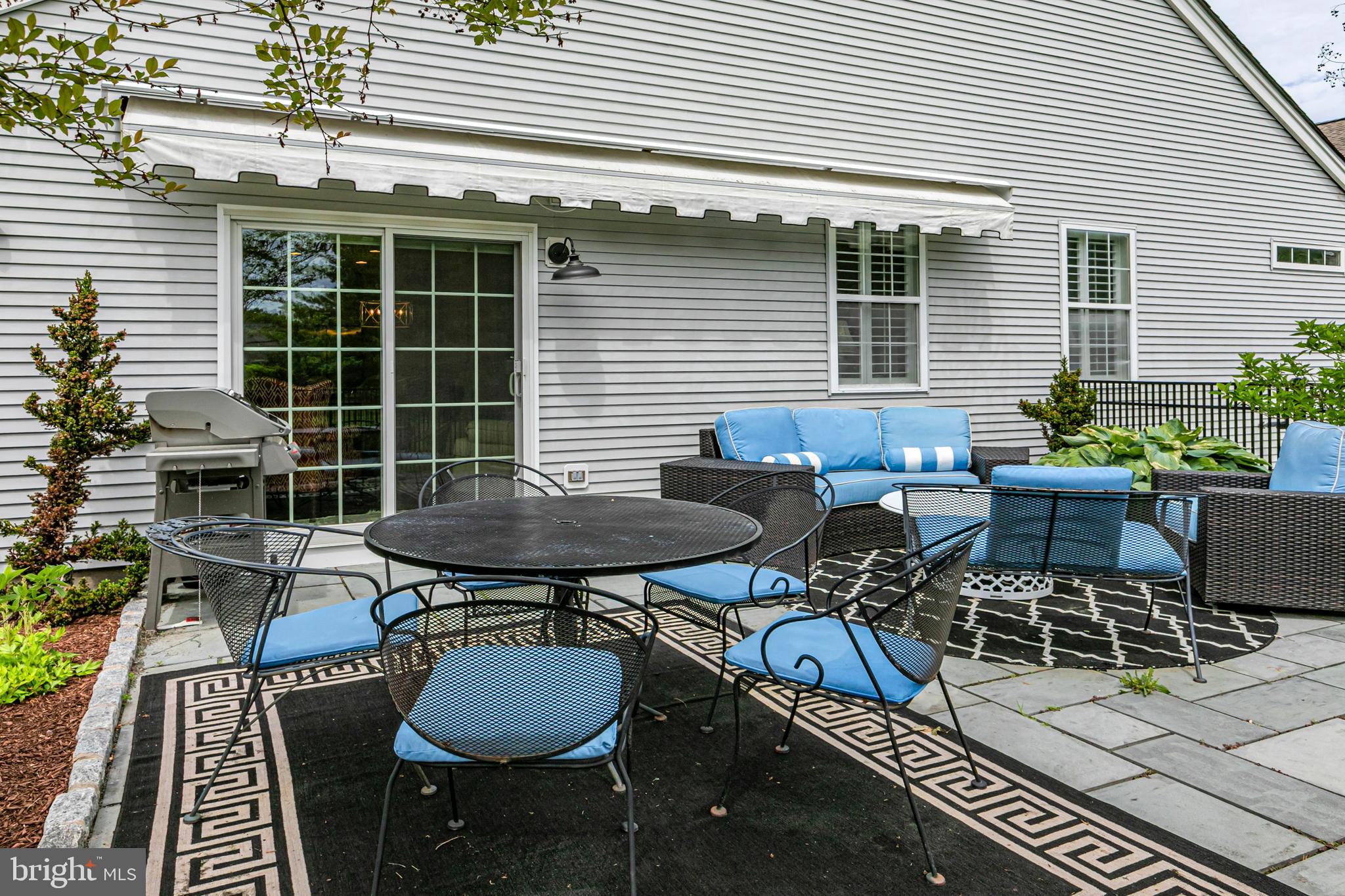 24 Foster Road Pennington, NJ 08534 - Photo 26 of 38 a backyard of a house with table and chairs