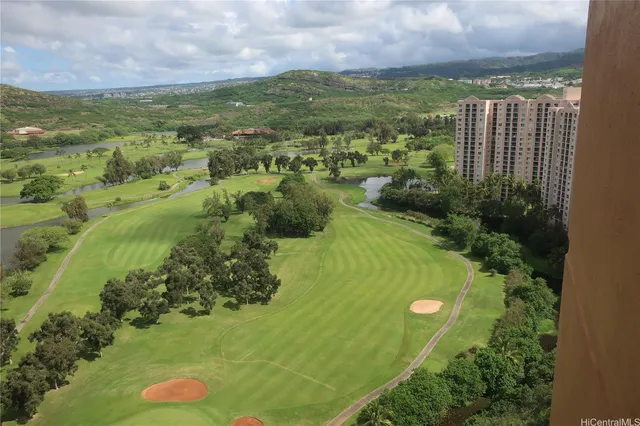 a view of a garden with a building in the background
