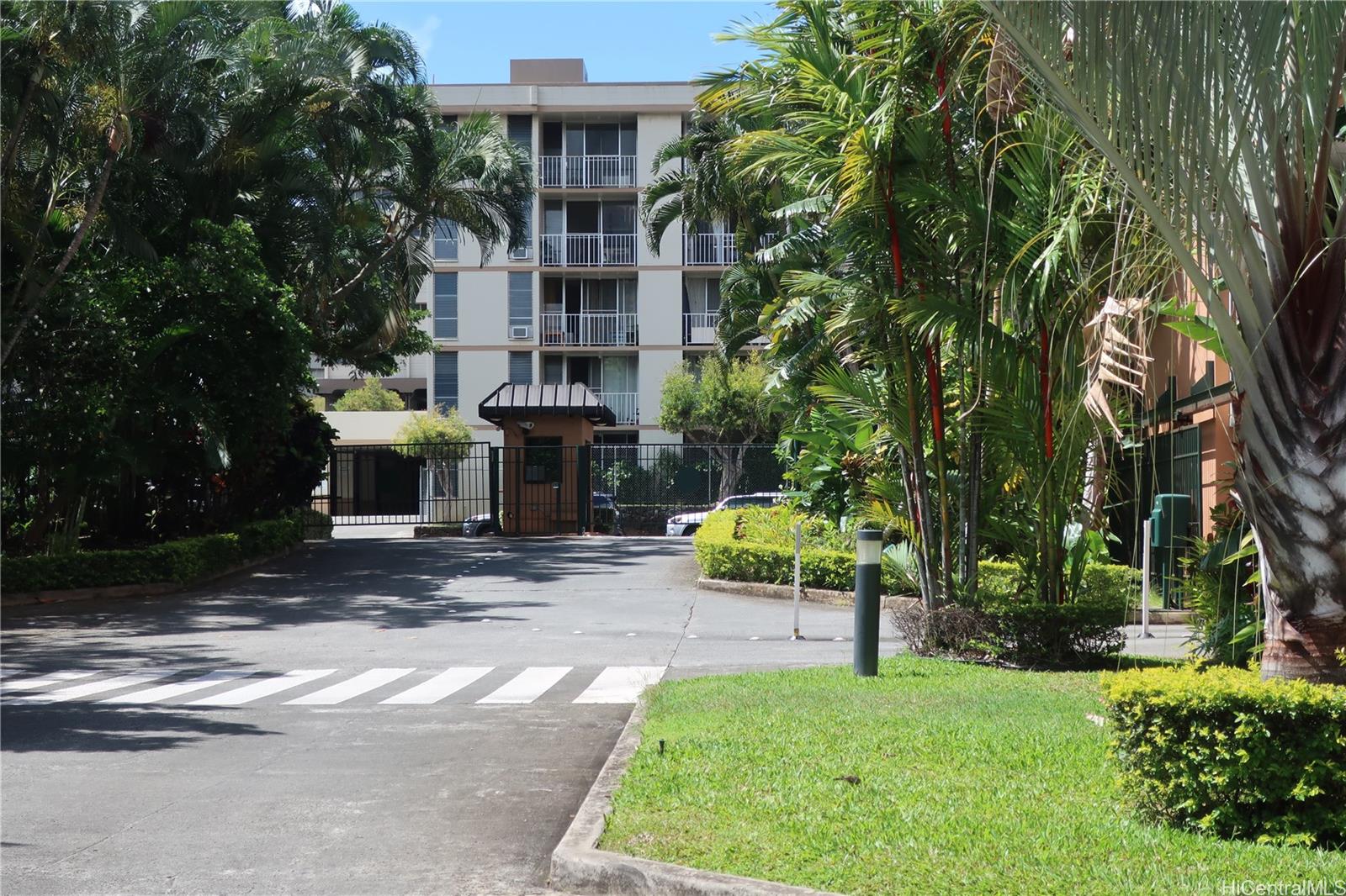 5333 Likini Street, Unit 2408 Honolulu, HI 96818 - Photo 2 of 20 a view of a building with a garden and pathway