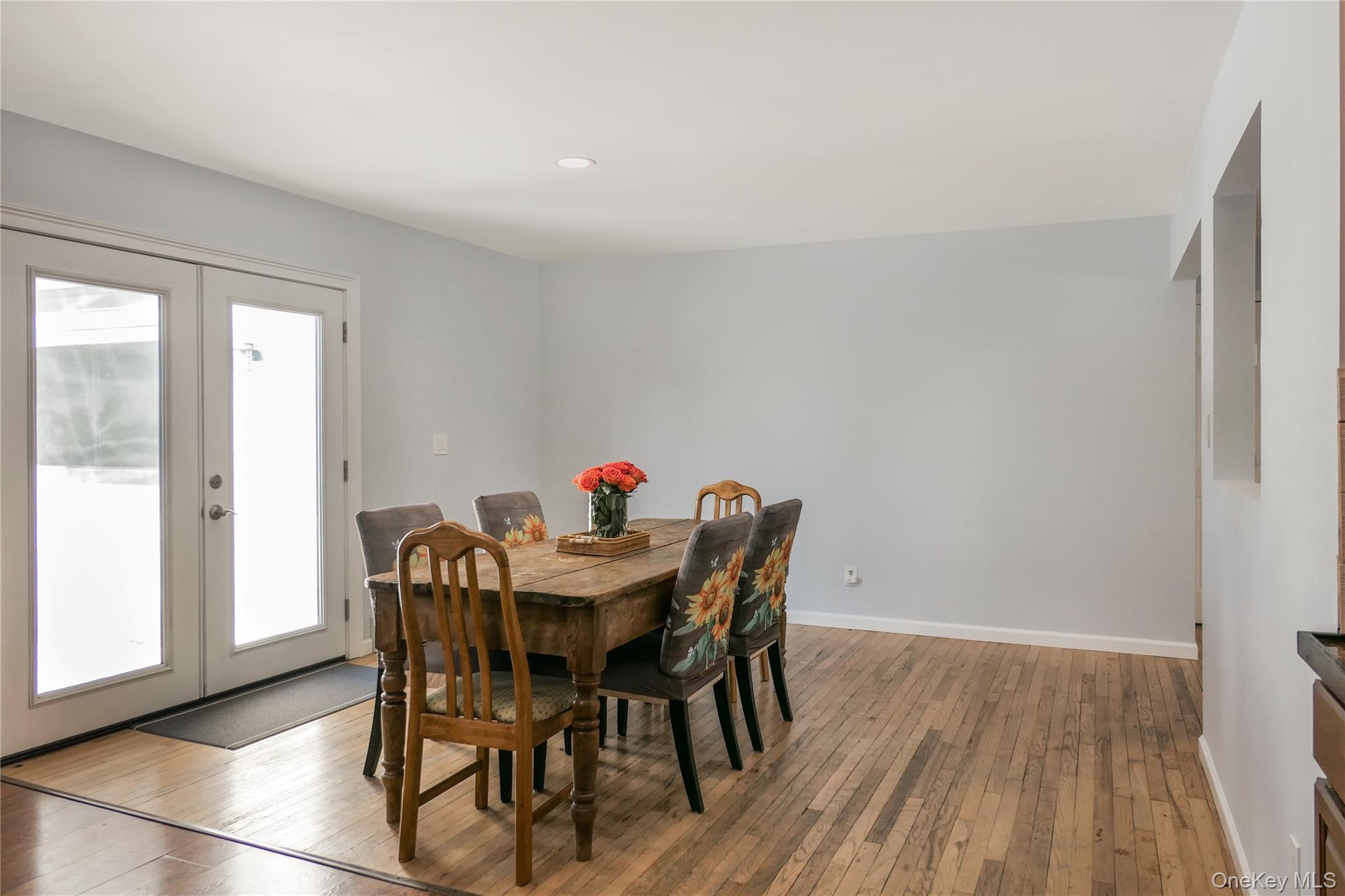 84 Bieselin Road Bellport, NY 11713 - Photo 7 of 20 a view of a dining room with furniture and wooden floor