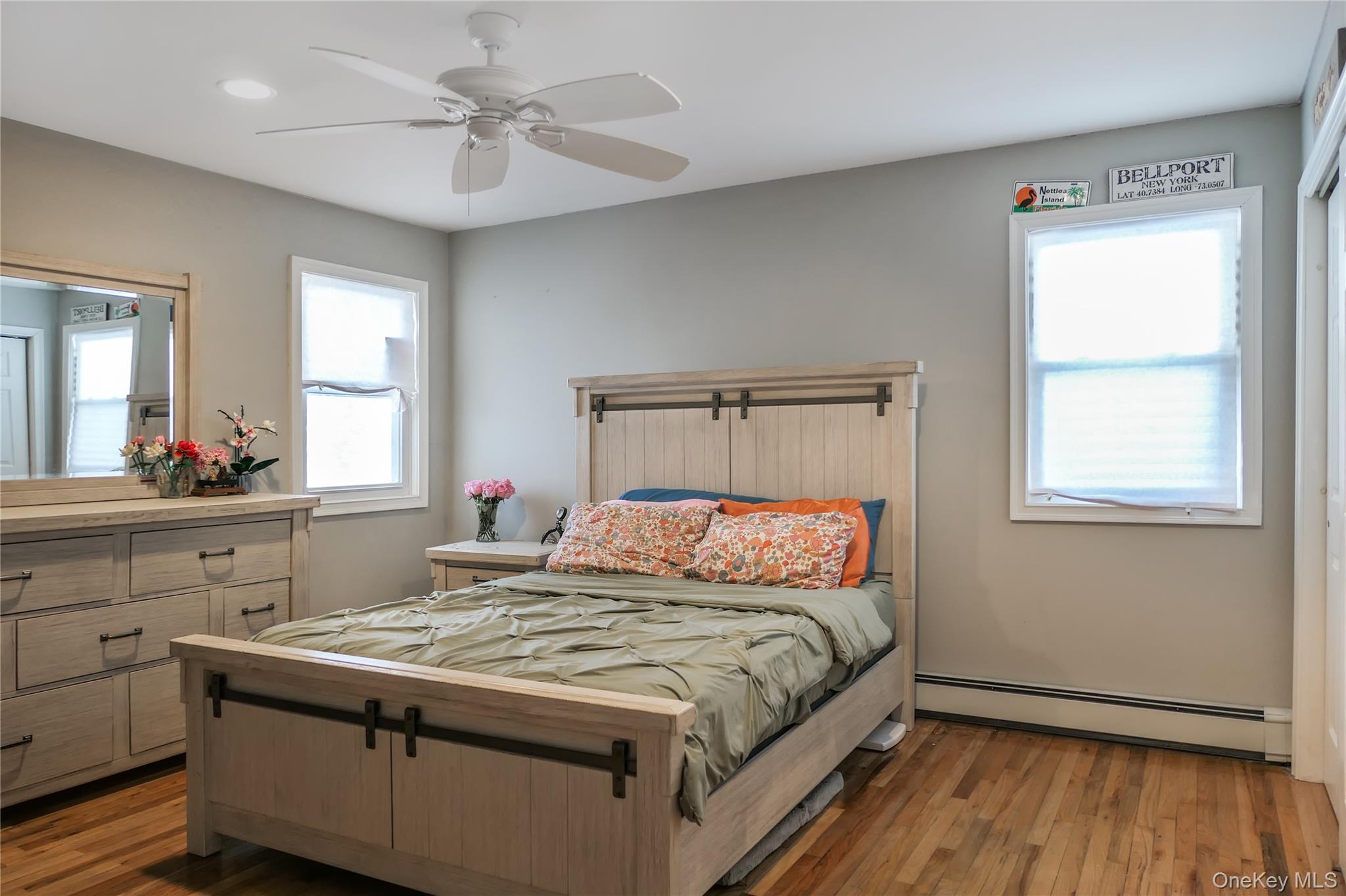 84 Bieselin Road Bellport, NY 11713 - Photo 8 of 20 a bedroom with a bed and a window