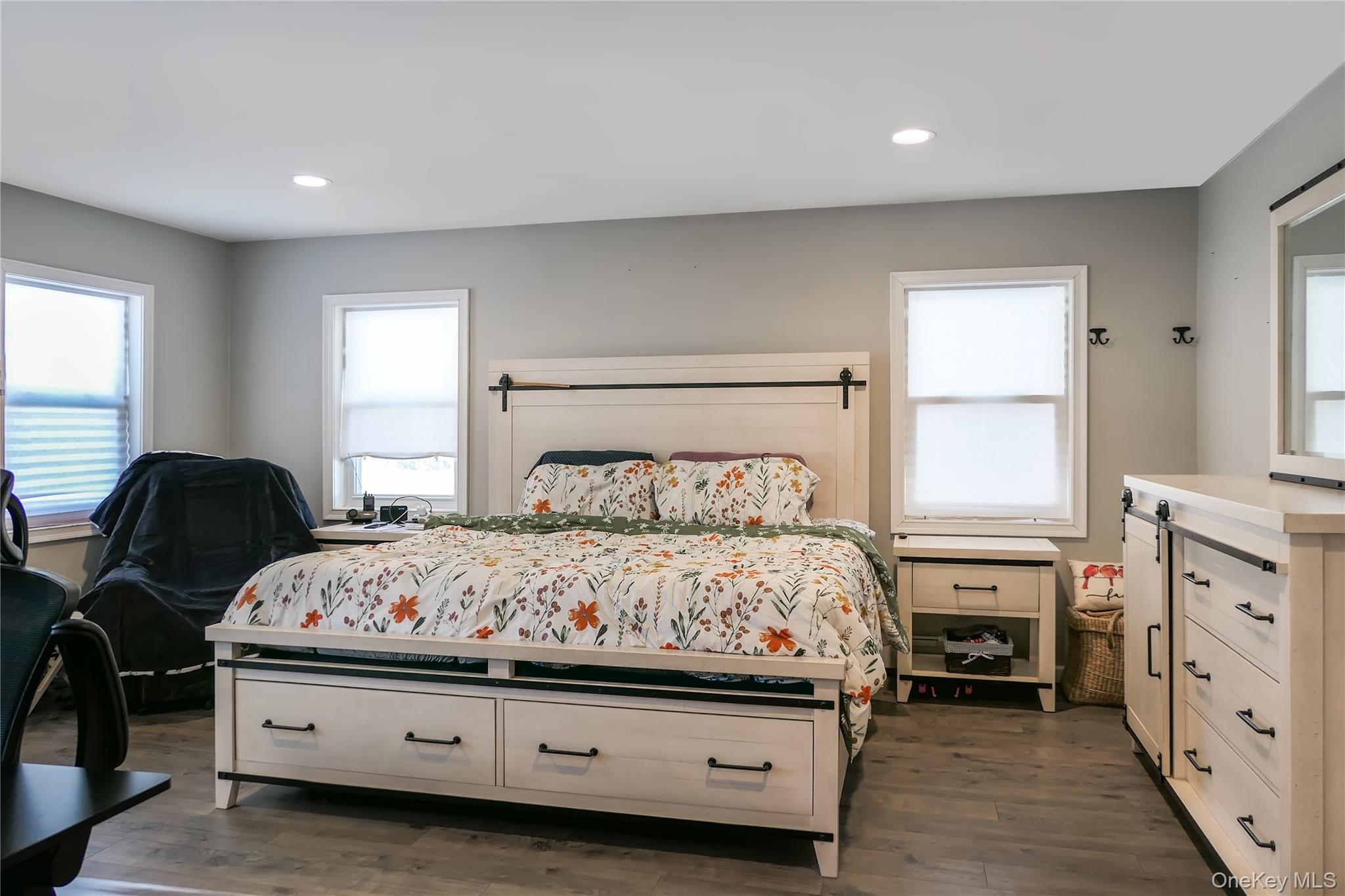 84 Bieselin Road Bellport, NY 11713 - Photo 9 of 20 a bedroom with a bed and a dresser