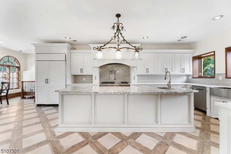 50 Rock Spring Road West Orange, NJ 07052 - Photo 15 of 37 a kitchen with stainless steel appliances a sink and cabinets