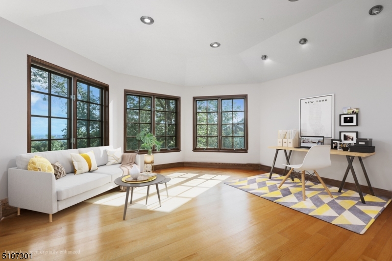 50 Rock Spring Road West Orange, NJ 07052 - Photo 23 of 37 a living room with furniture and a table with wooden floor