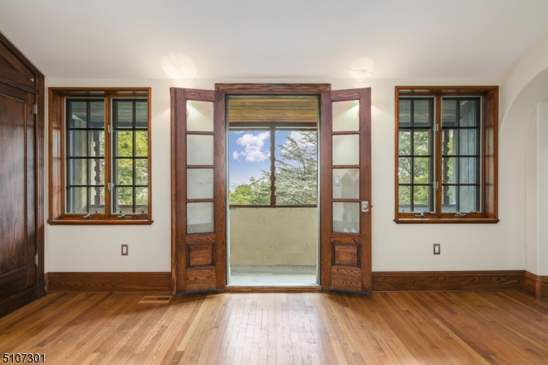 50 Rock Spring Road West Orange, NJ 07052 - Photo 28 of 37 an empty room with wooden floor and windows
