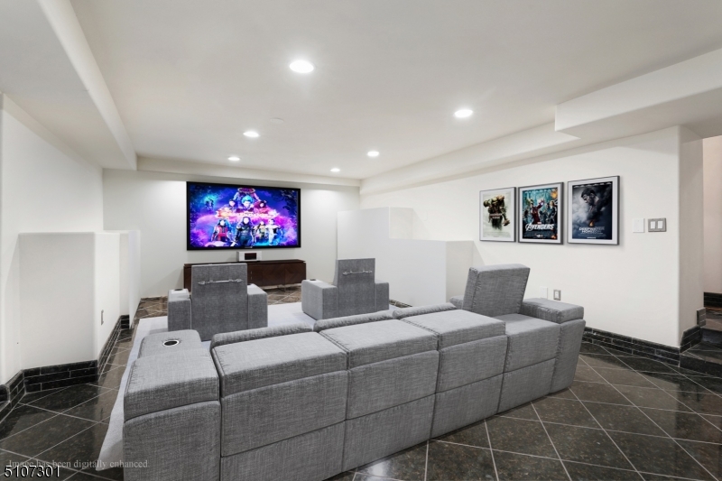 50 Rock Spring Road West Orange, NJ 07052 - Photo 31 of 37 a living room with furniture a flat screen tv and a lamp