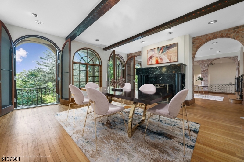 50 Rock Spring Road West Orange, NJ 07052 - Photo 10 of 37 a living room filled with furniture hardwood floor and a floor to ceiling window